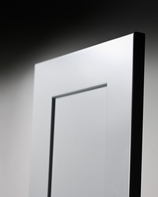 Close-up of white paneled door edge